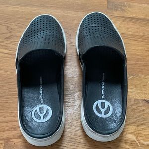 The WISHBONE Collection leather slides.